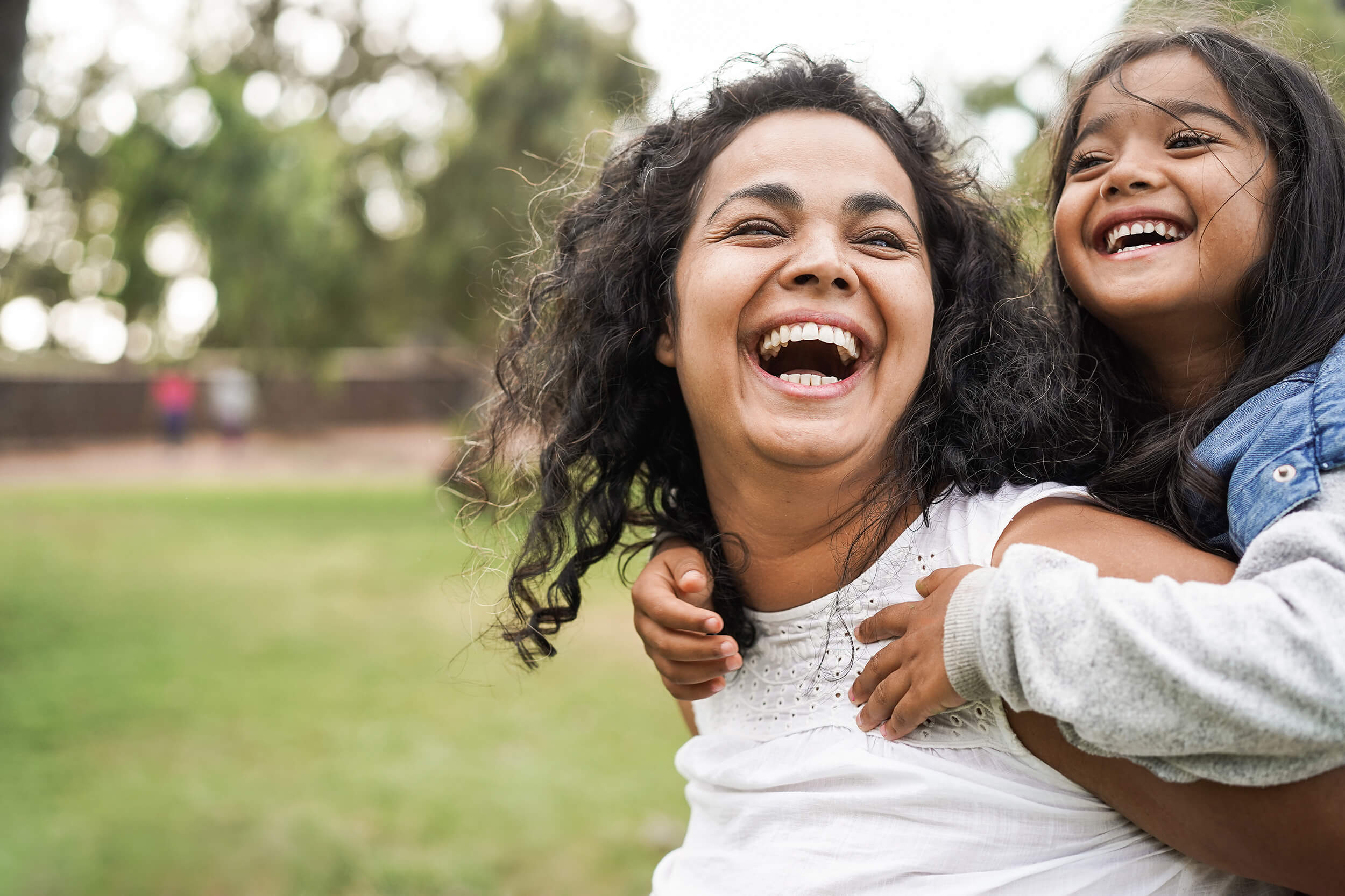 Mother and daughter laughing