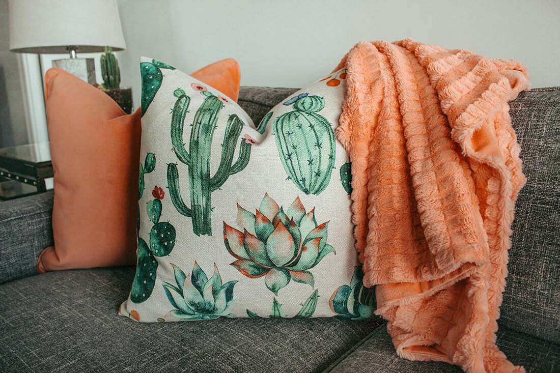 Cushions and blanket on sofa