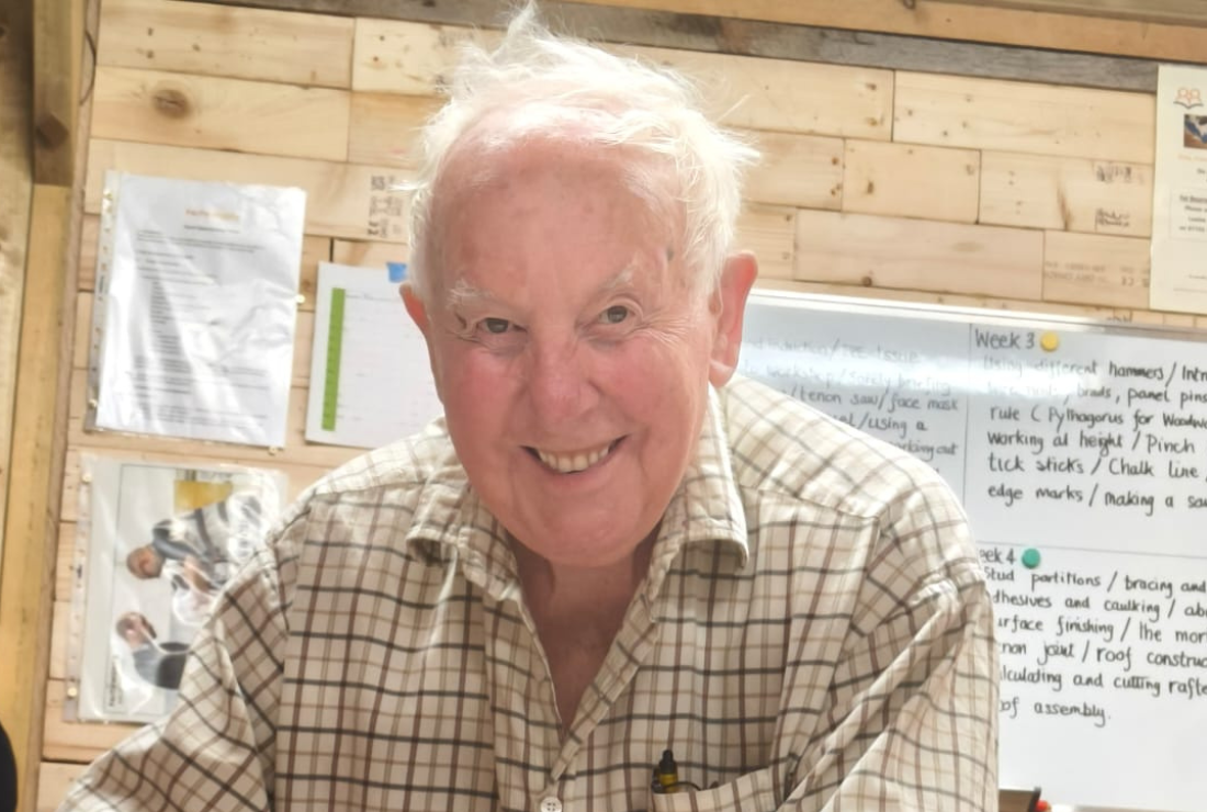 A man smiles at the camera
